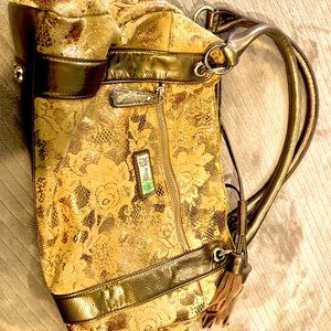 Lifestyles by Sharif New York Original 1827 gold and bronze in color